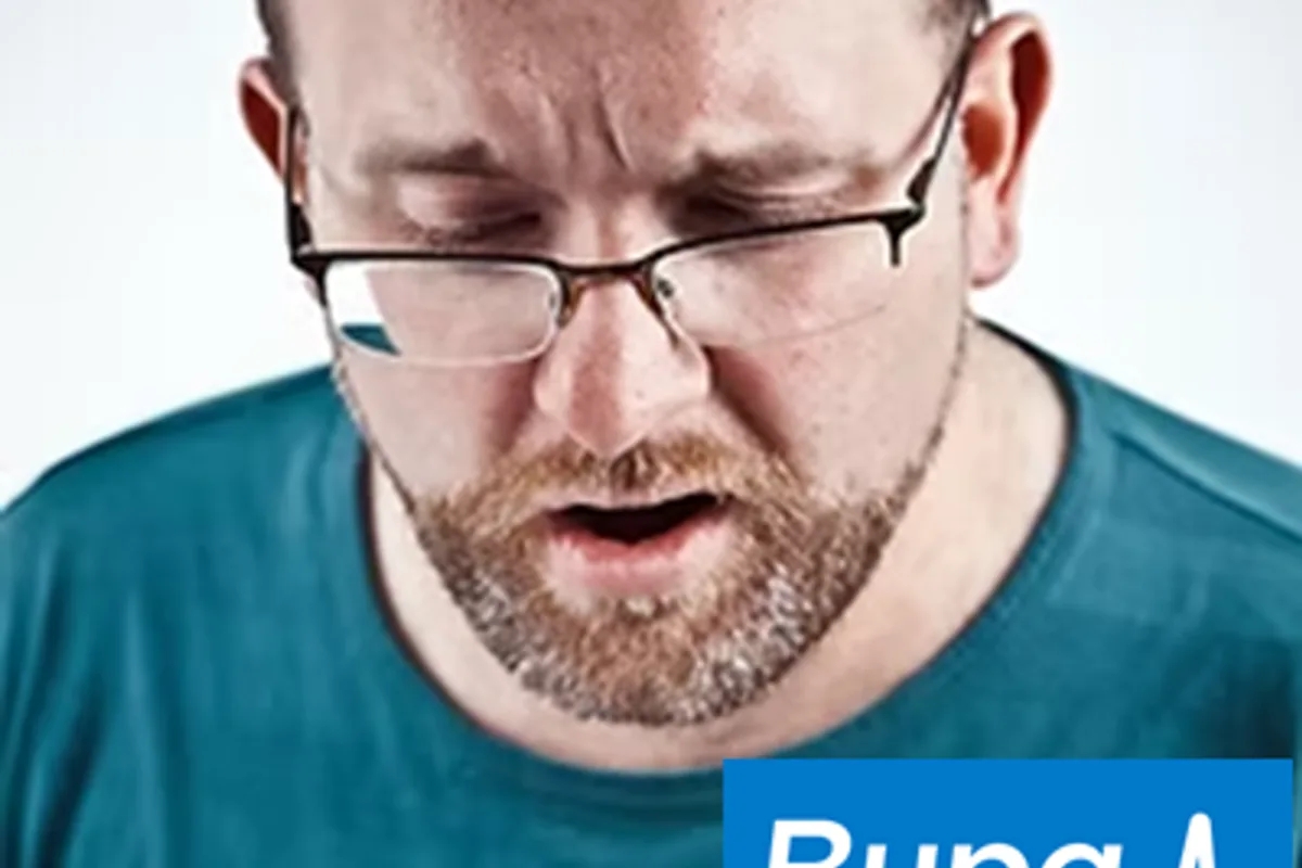 A customer reading a letter at home