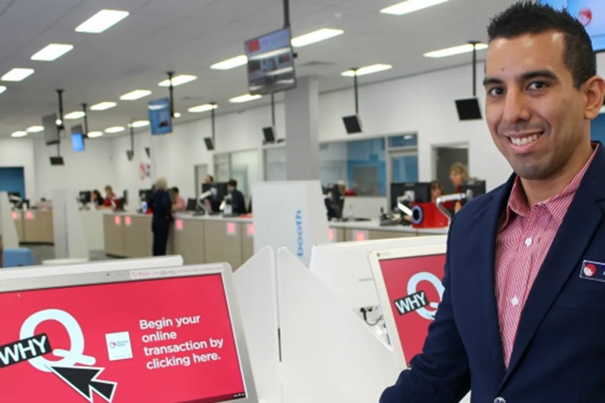 A Service NSW team member at a service centre counter