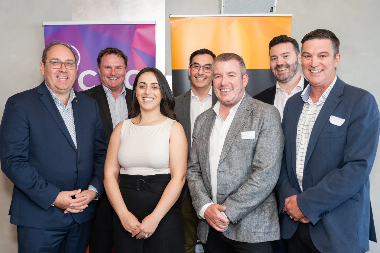 Five colleagues together at an industry event.